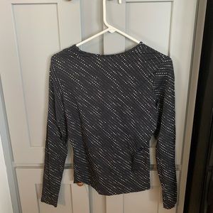 The limited black long sleeve polkadotted shirt